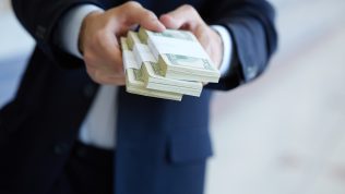 handing over money