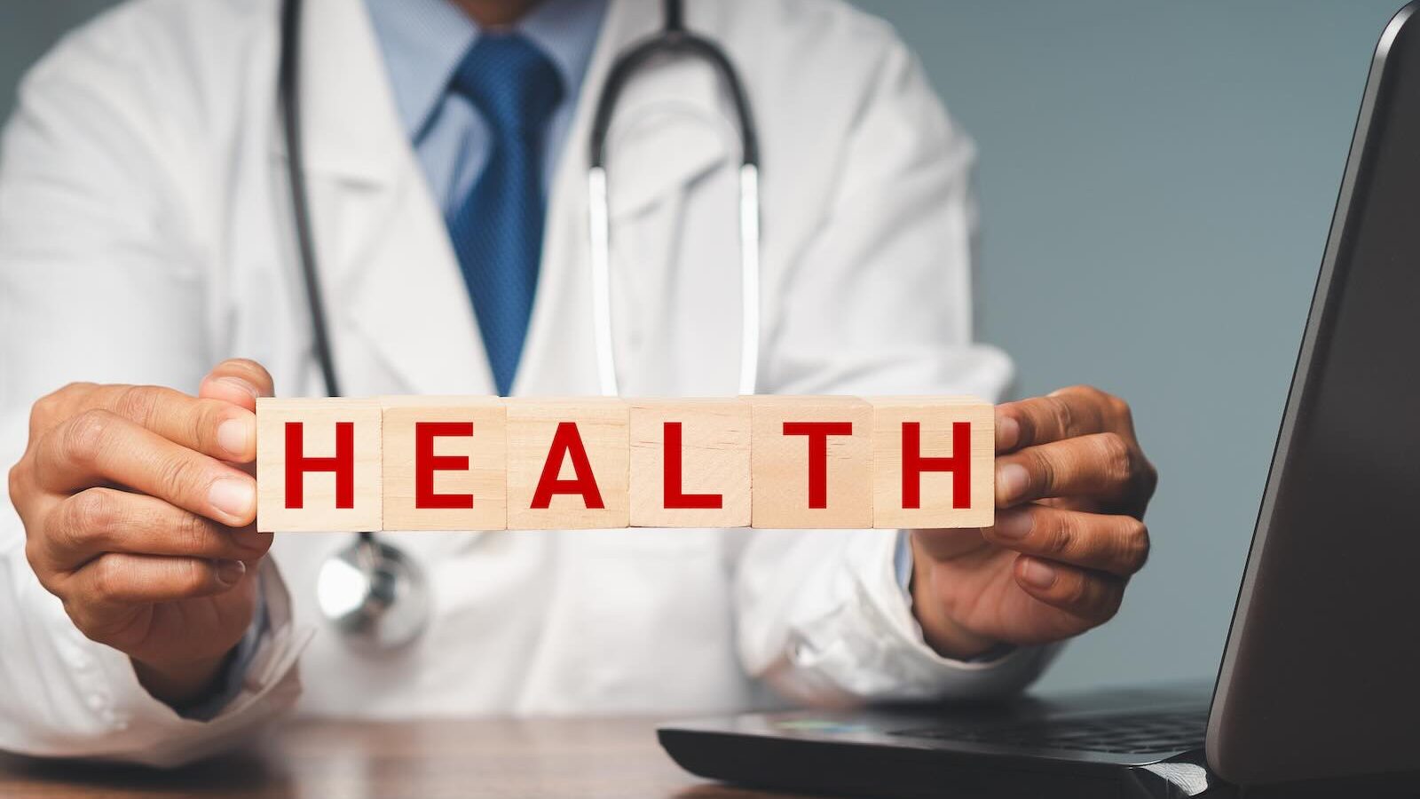 Doctor holding public health sign